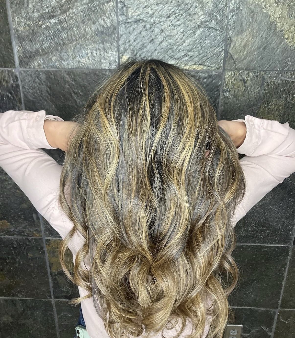 Sun-kissed blonde balayage photographed in natural light