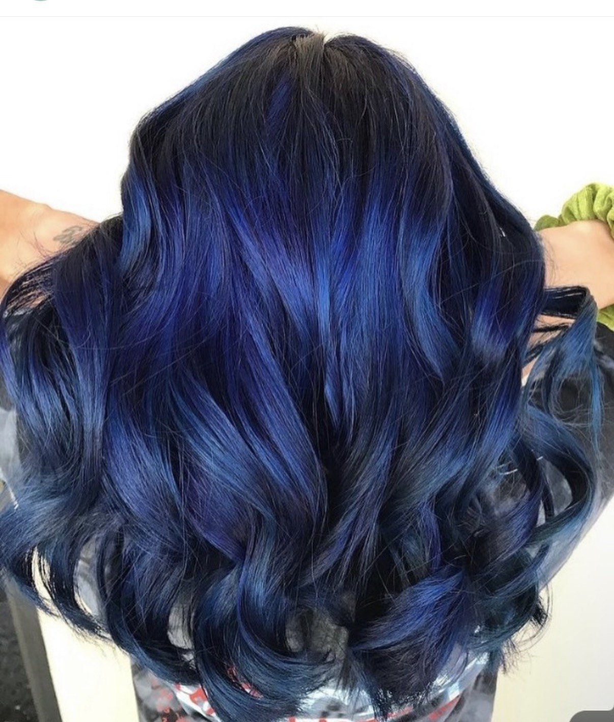 Deep navy blue vivid hair color melting into a dark base