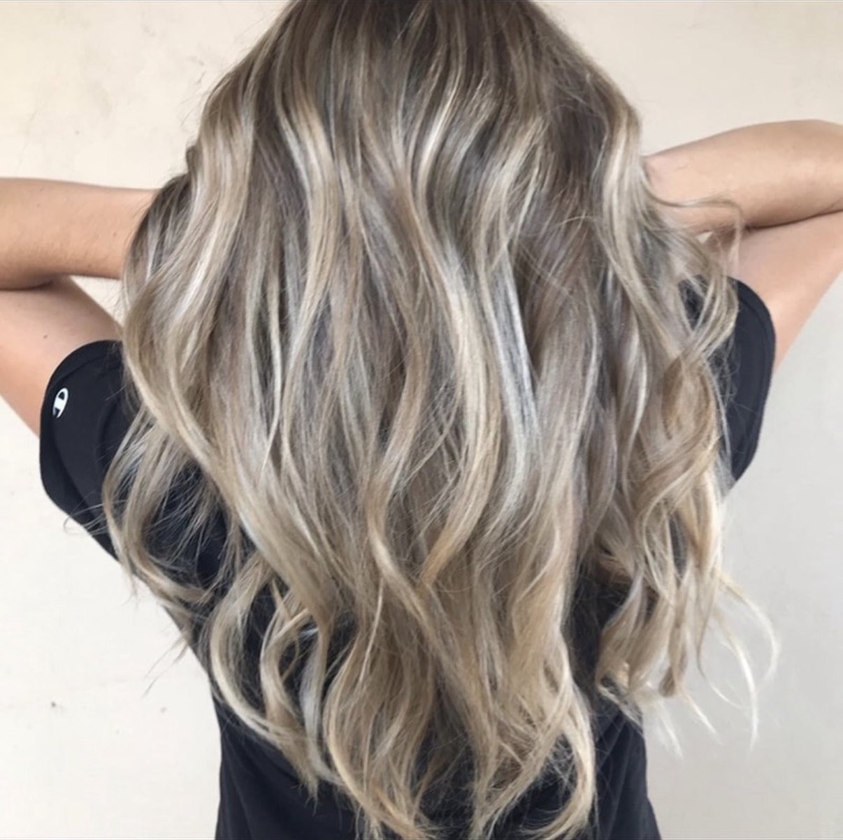 Cool icy blonde balayage with a soft shadow root