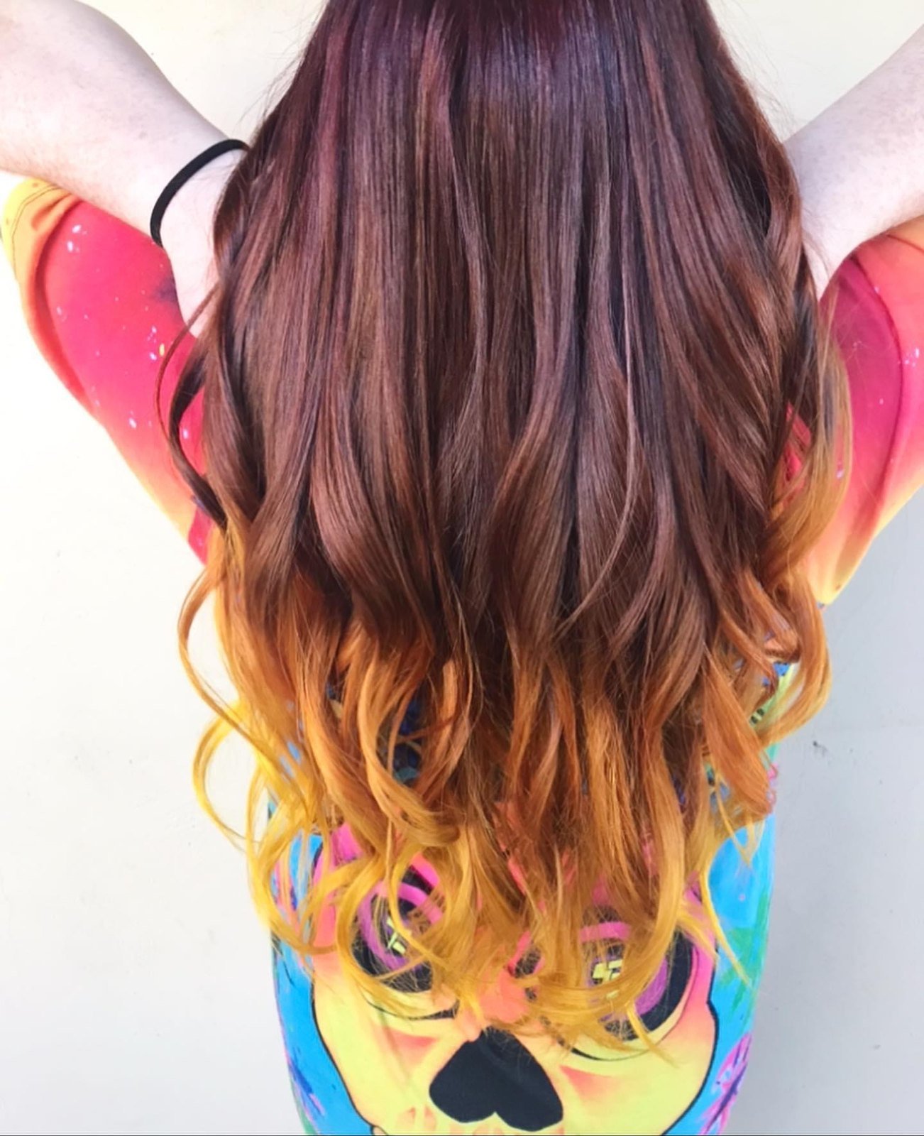 Rainbow sunset vivid hair color blending red, orange and gold